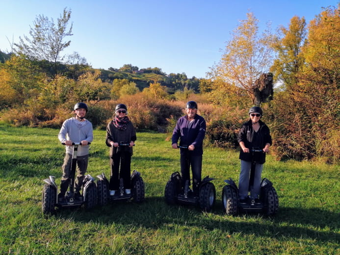 Group of Segway riders facing the mountain