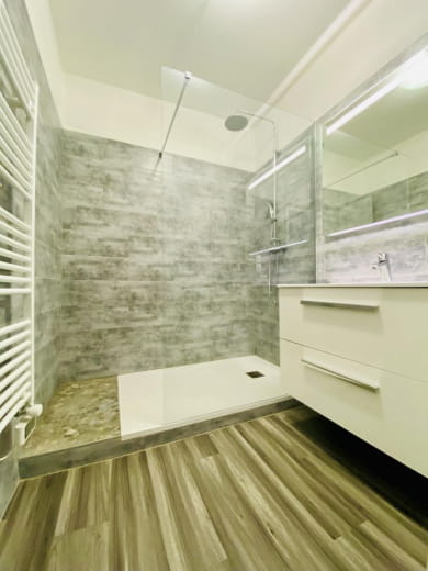 fully renovated bathroom with large walk-in shower