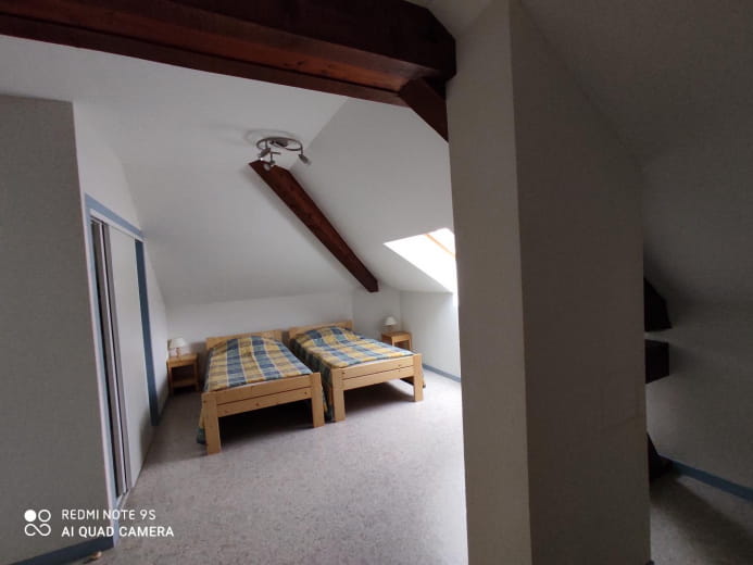 Spacious bedroom upstairs with 2 single beds. Large built-in cupboard